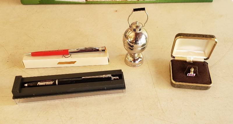 lot 2414 image: Lot of Coleman No. 316 Arc Lantern Miniature 100 years , 30 year Service Pin (14 K), and (2) Pens