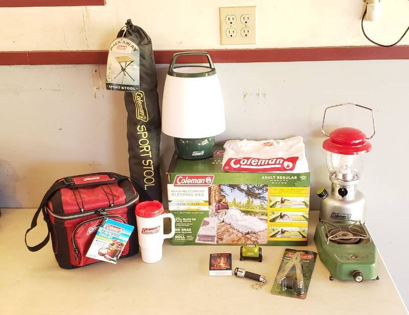 lot 2415 image: Lot of Coleman Camping Accessories - Sleeping Bag, Battery Powered Lanterns, Propane Camp Stove (1973), Sport Stool, Cooler Campers Tool, and Other Items