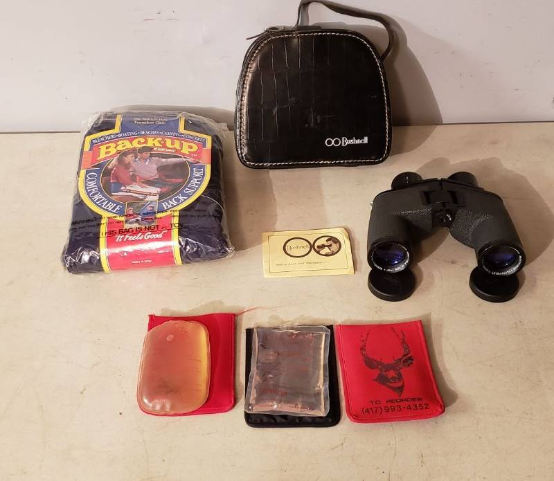 lot 2428 image: Lot of Outdoor Items - Bushnell Featherlite Magnesium 7 Power, Frameless Chair, and Hand Heaters