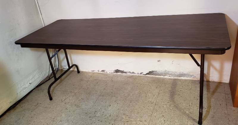 lot 2434 image: 6 Foot Wood Top Folding Table