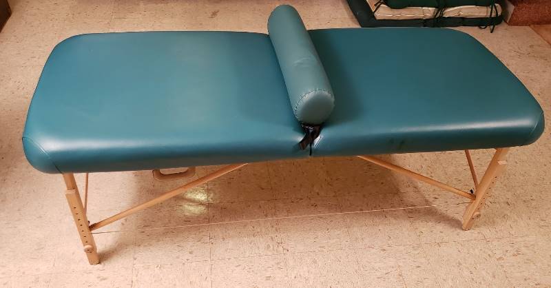 lot 2480 image: Golden Ratio Woodworks Fold Up Teal Vinyl Massage Table - 30 in. x 73 in. with adjustable height legs