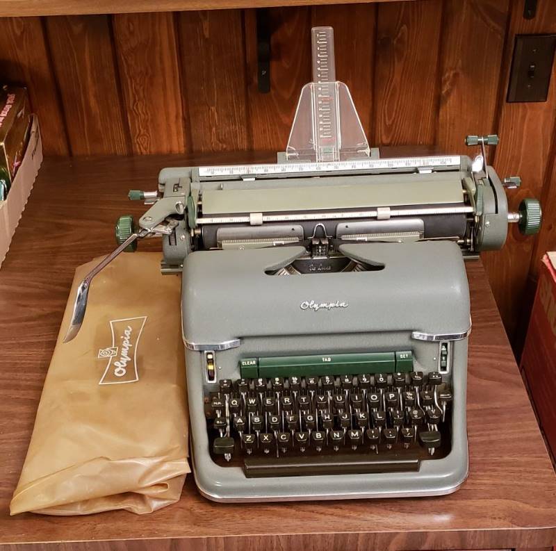 lot 2481 image: Vintage Olympia Manual Typewriter with Clear Vinyl Cover - Made in West Germany - works