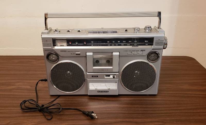 lot 2489 image: Sanyo M9978F Boombox AMFM Stereo Cassette - Radio Works but Cassette Does not - 18 in. x 4 in. x 13 in.
