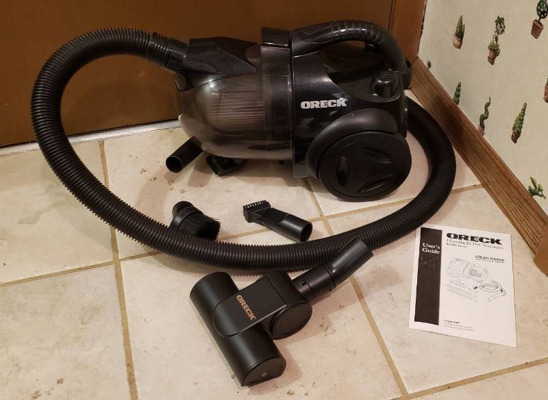 lot 2518 image: Oreck Handheld Pet Vacuum with Accessories - works
