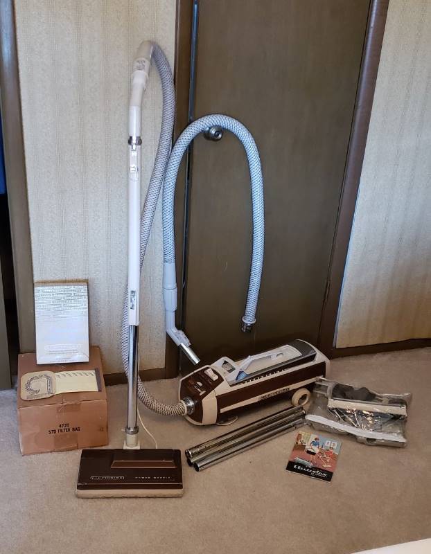 lot 2519 image: Vintage Electrolux Canister Vacuum with Accessories, Extra Parts, and Lots of Bags - works