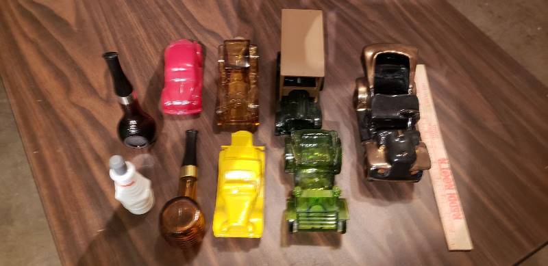 lot 2537 image: Lot of Men Style Avon Bottles and Decor
