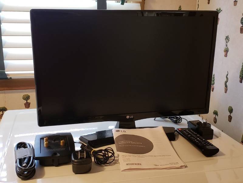 lot 2545 image: LG 22 in. 1080 LED TV with Remote - Model 22LH4530 - Works - comes with Radio Shack Antenna Signal Amplifier