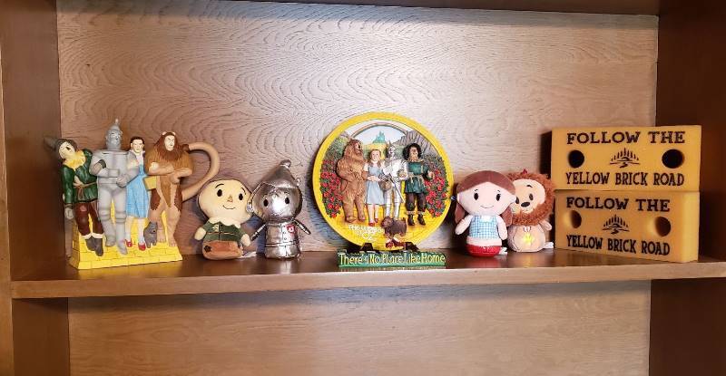 lot 2547 image: Lot of Wizard of Oz Dept 56 Storybook Village Tea Pot, Enesco Relief Wall Plaque and other Memorabilia