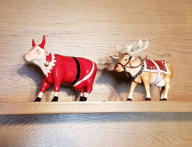 lot 2549 image: Lot of (2) Cow Parade Figurines Santa and Moodolph