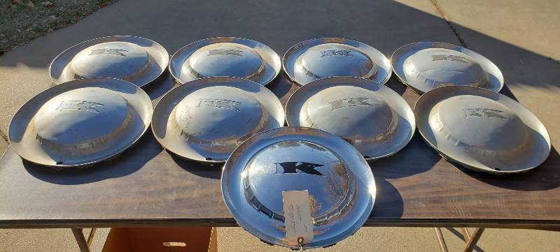 lot 2573 image: Kaiser 1950s Car Parts - 15 in. Kaiser Solid Hub Caps - 9 total