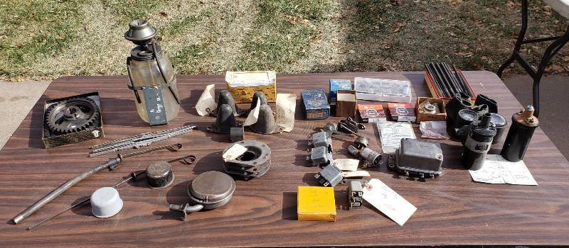 lot 2605 image: Kaiser 1950s Car Parts - Coils, Relats, BearingsSeals, Insulators, Windshield Washer, Timing BeltGears, and Oil CapsDipsticks