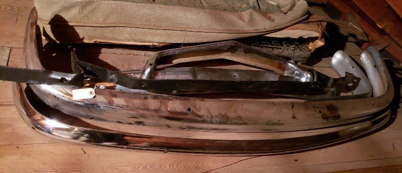 lot 2629 image: Kaiser 1950s Car Parts - Bumpers (3), Rear Bumper Attachment, and Bumper Support - in Garage Attic