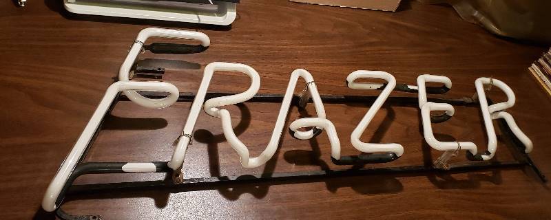 lot 2638 image: Frazer Neon Sign 29 in. x 9 in.