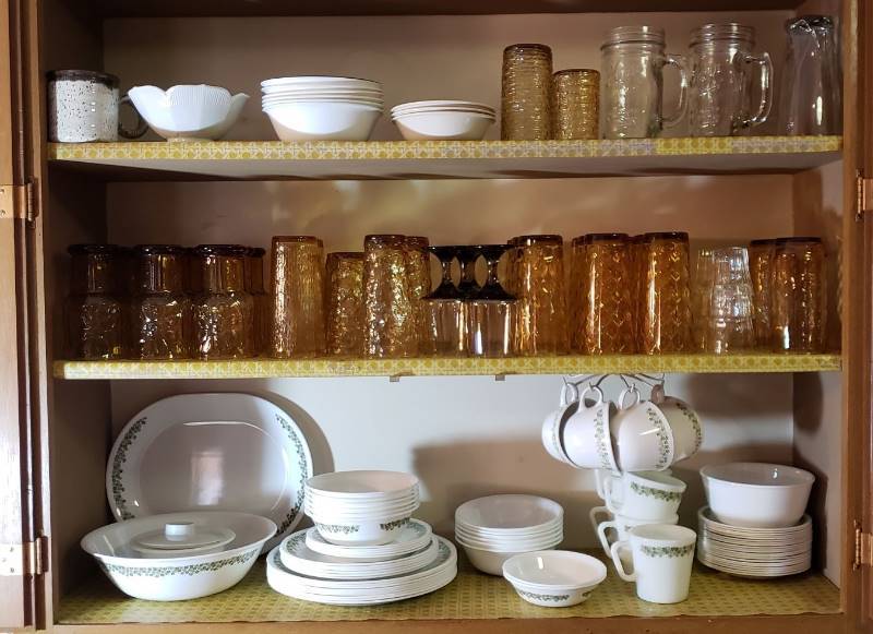 lot 2692 image: Lot of Green Flower Corelle Dishes, Amber Glass Sets, and Extra Dishes