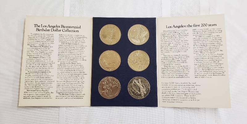 lot 2777 image: Los Angeles Bicentennial Birthday Dollar Collection in Special Souvenir Package - each Medallion - 1 12 in. diameter