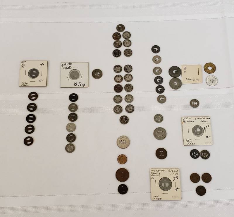 lot 2837 image: Lot of Kansas Transportation Tokens - KC, Leavenworth, Lawrence, Topeka, Pittsburg, Ark City, Winfield, Wichita, and Salina