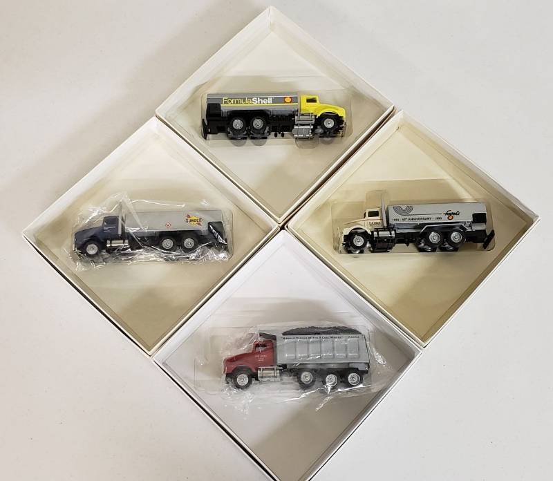 lot 2940 image: Lot of Winross Trucks - 3 Fuel Trucks & 1 Dump Truck