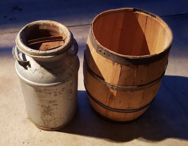lot 2951 image: Lot of 2 Primitive Items - Metal Milk Can and Wood Slat Barrel - both are 24 in. tall