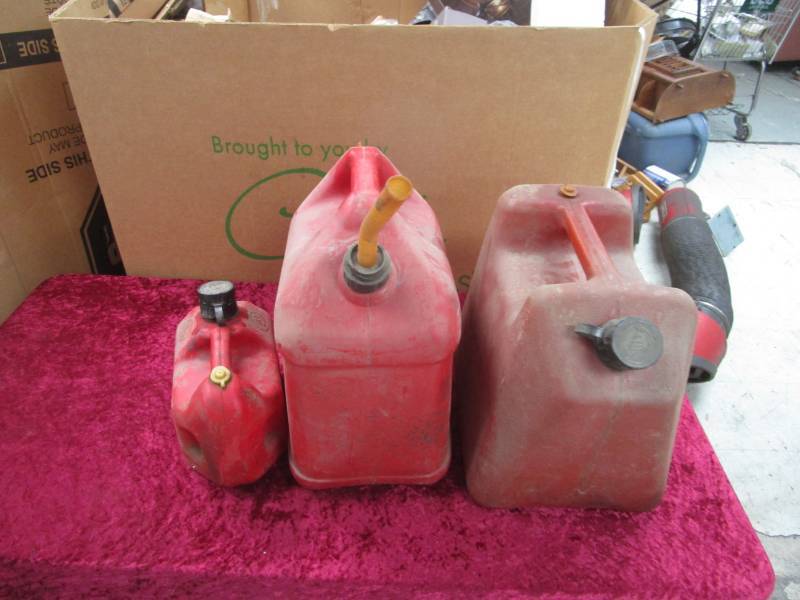 lot 2808 image: Three Plastic Gas Cans