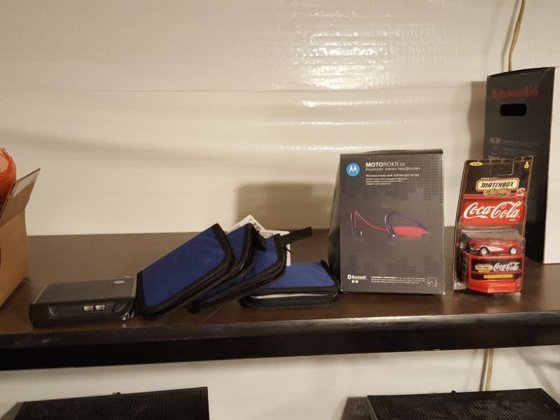 lot 3343 image: Motorola headphones, CD cases and Coca-Cola Matchbox car