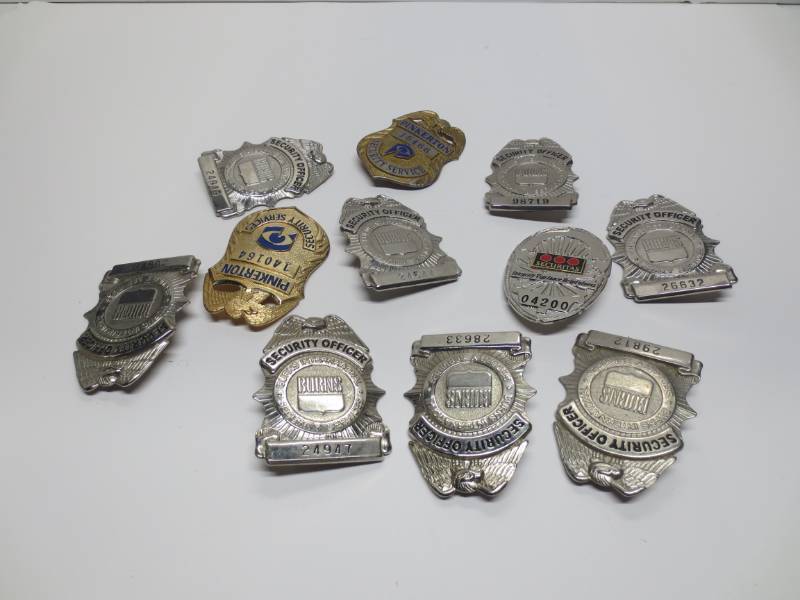 lot 1005 image: Lot of security guard badges