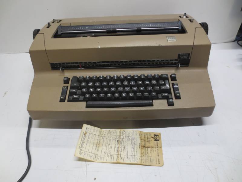 lot 1237 image: IBM correcting selectric 2 tan typewriter with service schedule