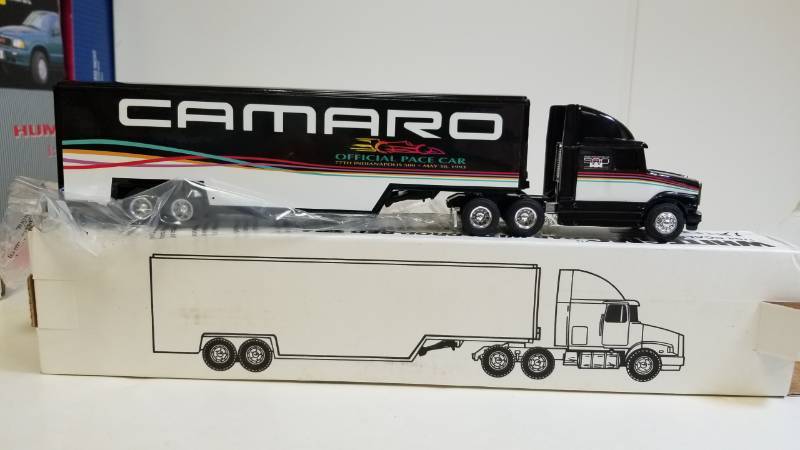 lot 3229 image: Ertl White GMC Cab wCAMARO Drop-Bed Trailer, 164 scale, NIB