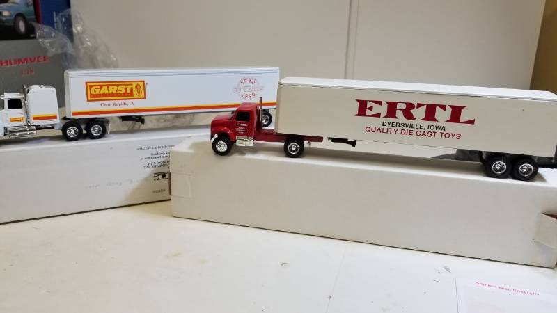 lot 3237 image: 2 ERTL Semi, 164 scale  1) GARST Seed Company  2) Red Navistar single Axel Tractor wwhite ERTL Trailer, both NIB