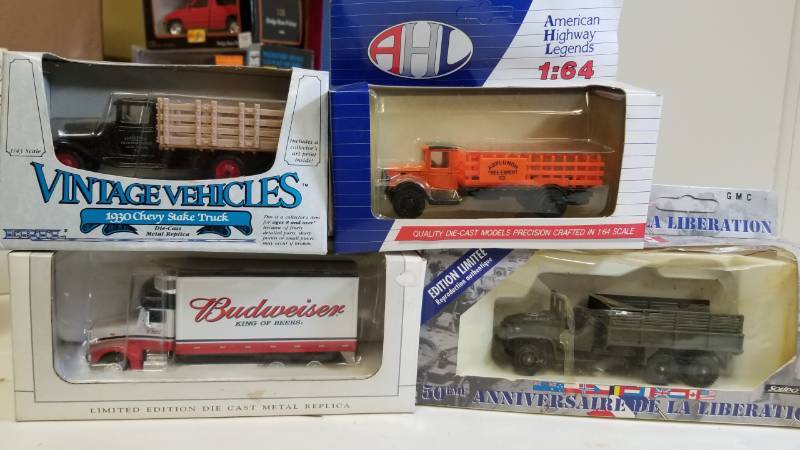 lot 3268 image: 1 lot, AHL 164 Rack Stake TruckArmy Duce and 12 Truck1930 Chevy Stake TruckSpeccast Peterbuilt 383 Bud Truck, NIB