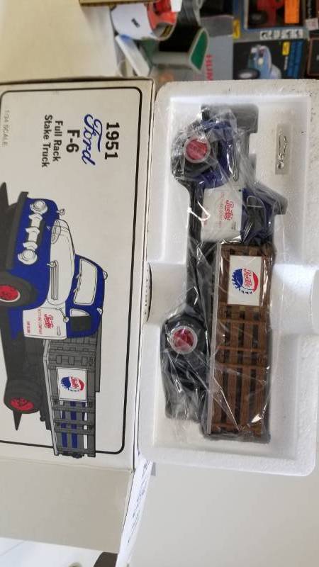 lot 3285 image: First Gear 1951 Ford F-6 Full Rack Stake Truck, 134 scale, new in box, See Pix