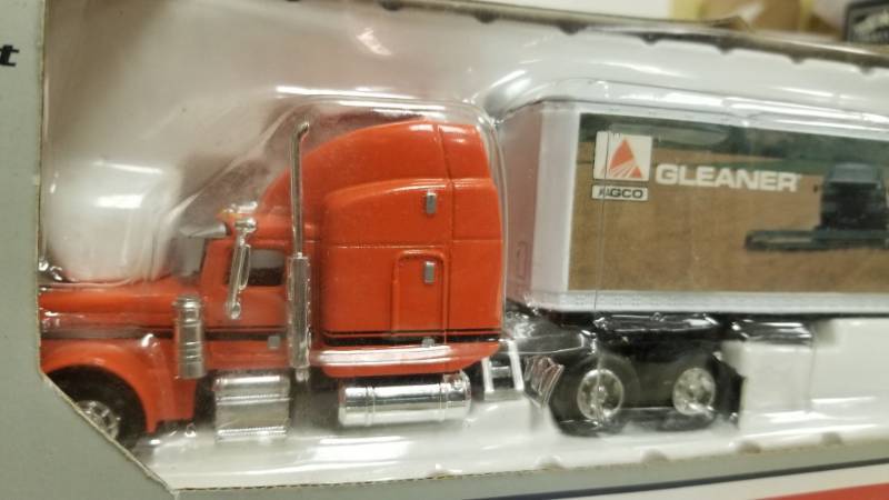 lot 1122 image: 164 Scale Peterbilt 379 Agco Gleaner Semi Truck & Trailer By Liberty Classics