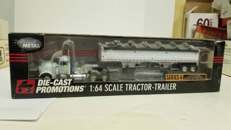 lot 1144 image: Dcp 30832 Owner Operator Pete 379 Semi Cab Truck Wilson Grain Trailer 164 Die Cast Promotions