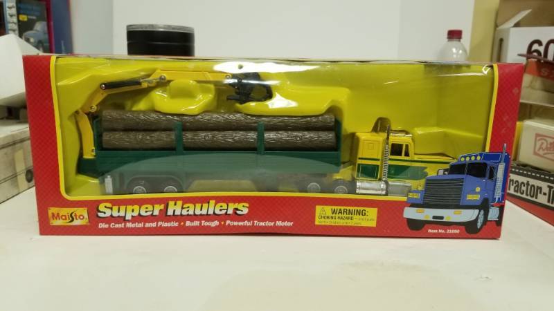 lot 1217 image: Maisto Super Haulers By Mighty Motors Auto Transport Truck 143 Nosmib