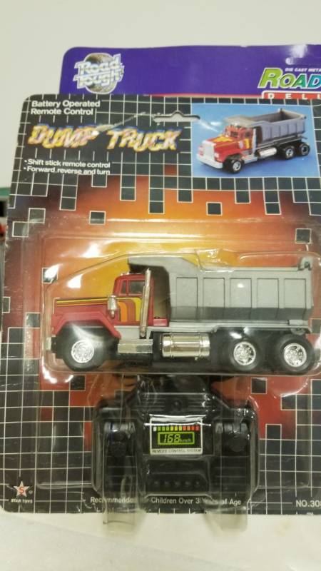 lot 1251 image: star toys battery operated dump truck remote card folded, new in package, #3086A