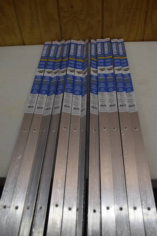lot 24 image: 12 Frost King Aluminum and Vinyl Under Door Thresholds