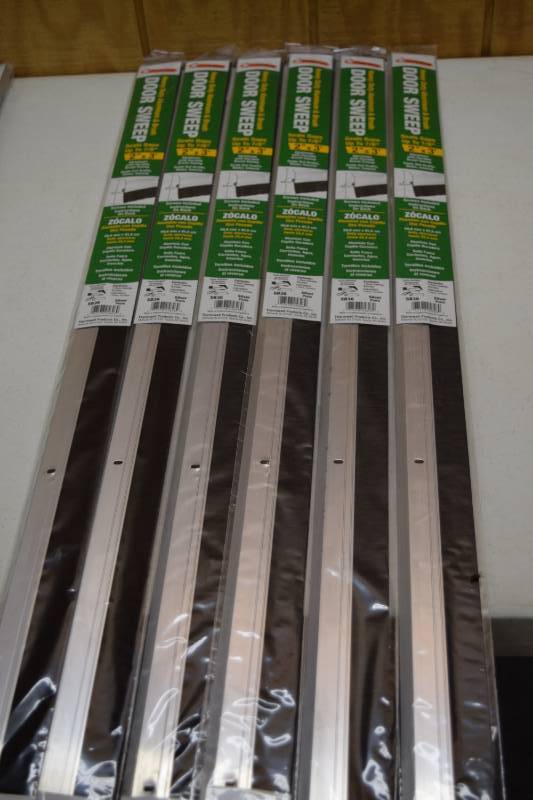lot 22 image: 6 Frost King Heavy Duty Aluminum and Brush Door Sweeps