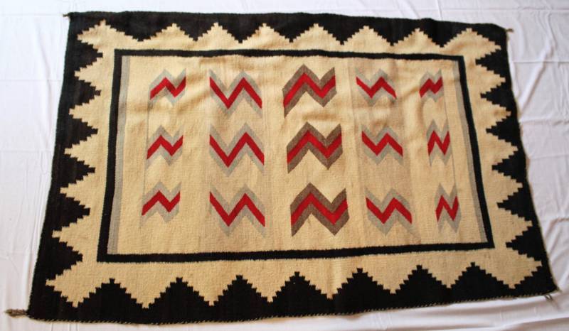 lot 49 image: Native American Rug or Blanket.  Black border with red and gray design.