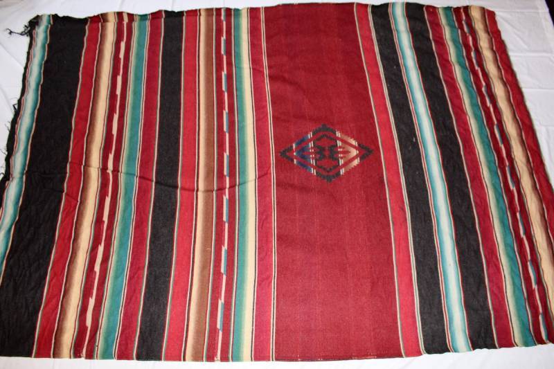 lot 51 image: Native American Rug or Blanket - Red, black, blue, tan striped with diamond design in center