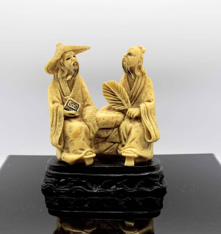 lot 1071 image: Carved Resin Grouping with Two Asian Men Sitting