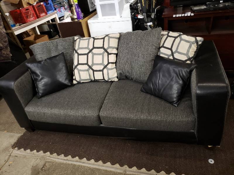 Beautiful Gray Couch With Black Leather Trim And Accent Pillows