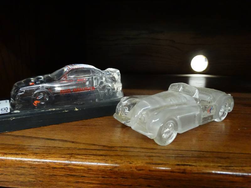lot 1511 image: 2 glass Mid America Auto Auction cars- 1 says Bill Phillips inside-