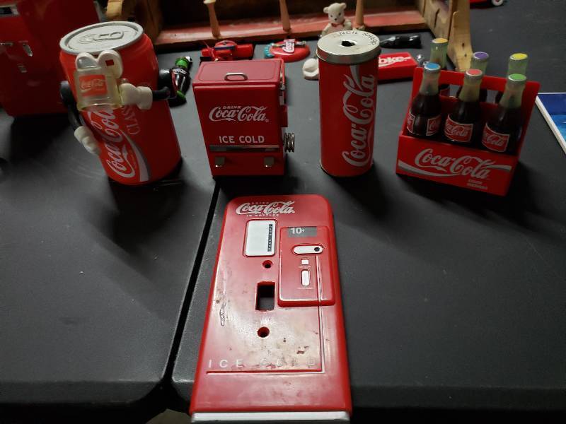 lot 9368 image: Coca Cola Pencil Sharpener, Tooth Pick Holder, Piggy Bank, and More