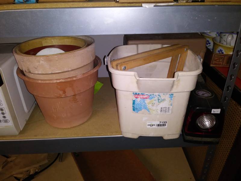 lot 7155 image: Lot with bucket, campbell hausfeld light, flower pots and storage organizer.