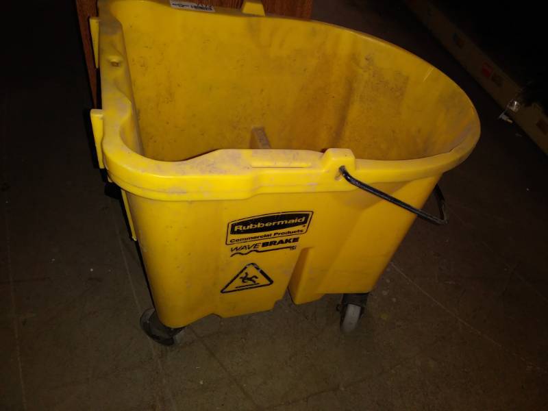 lot 7172 image: Yellow mop bucket.