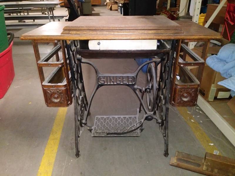 lot 7198 image: Sewing machine in cabinet.