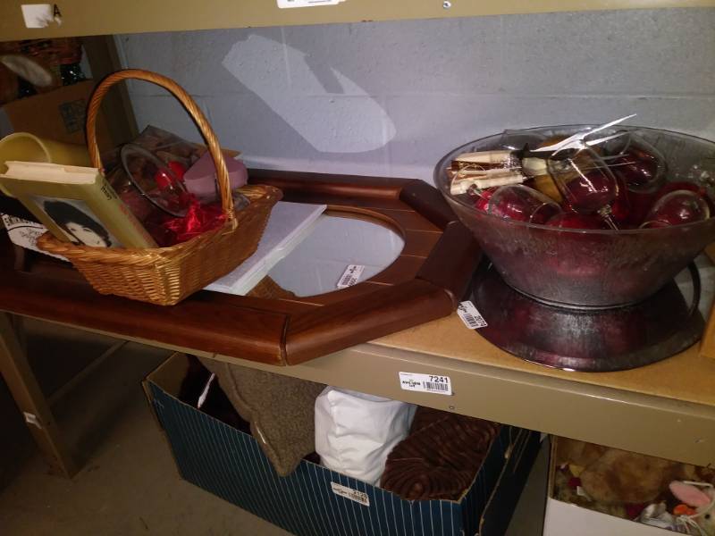 lot 7241 image: Lot with wall mirror, book, large glass punch bowl, christmas decor and more.
