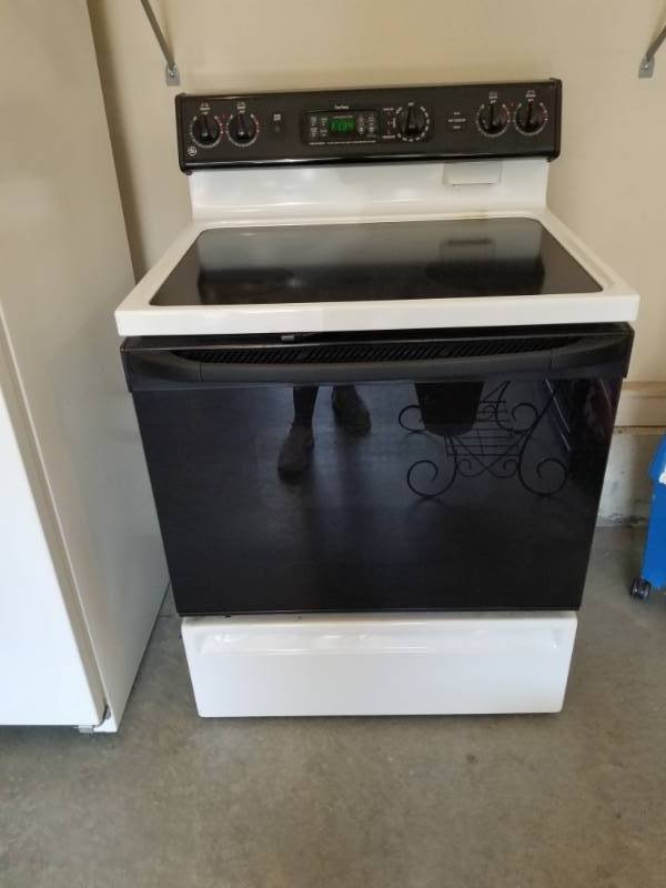 lot 47 image: WhiteBlack Flat Top Electric Stove  Oven