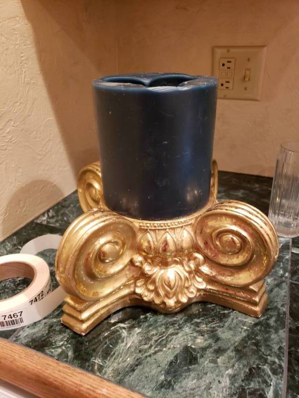 lot 7466 image: Decorative candle base with candle.