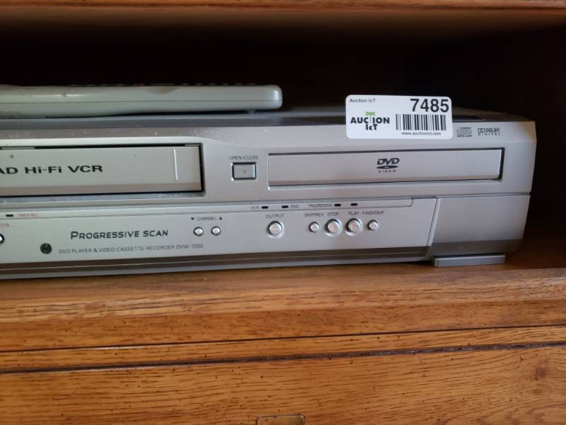 lot 7485 image: Sanyo VCR and DVD player with remote.