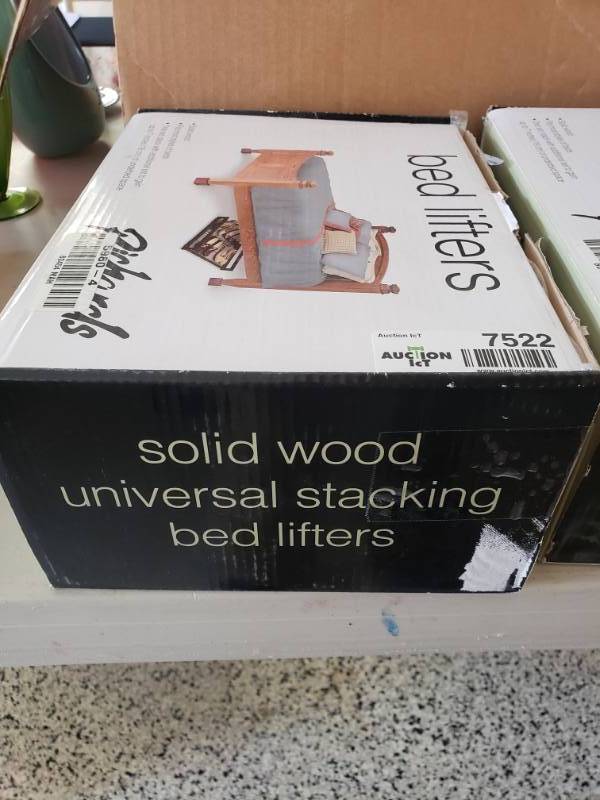 lot 7522 image: Set of 4 solid wood bed lifters